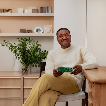 portrait of tolu adeko with his treasured object photography by andrew urwin