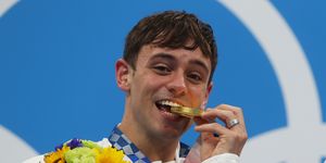 tokyo, japan   july 26 tom daley of team great britain poses with the gold medal during the medal presentation for the mens synchronised 10m platform final on day three of the tokyo 2020 olympic games at tokyo aquatics centre on july 26, 2021 in tokyo, japan photo by clive rosegetty images