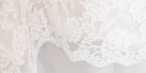 White, Clothing, Lace, Dress, Shoulder, Textile, Outerwear, Waist, Embellishment, Bridal accessory, 
