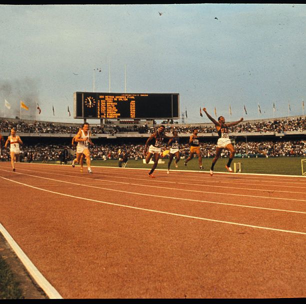 tommie smith crossing the finish line