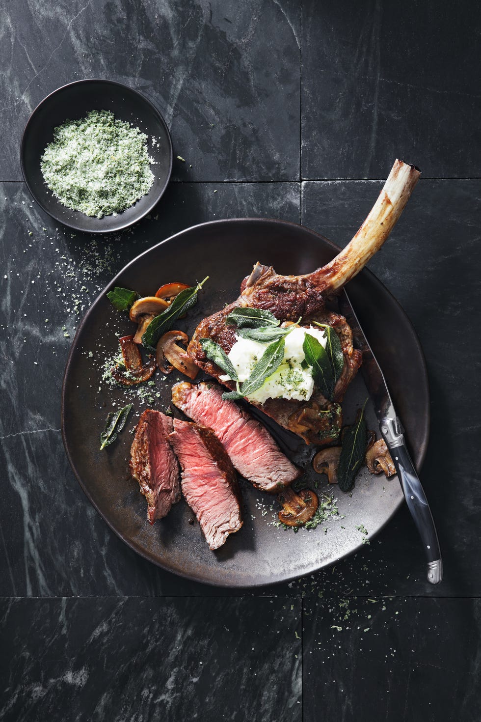 Tomahawk beef steak with mushrooms, burrata and sage