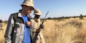 Meteorite expert Tomas Kohout (left) and gamekeeper Kegilwe Mogotsi in Botswana’s Central Kalahari Game Reserve. 