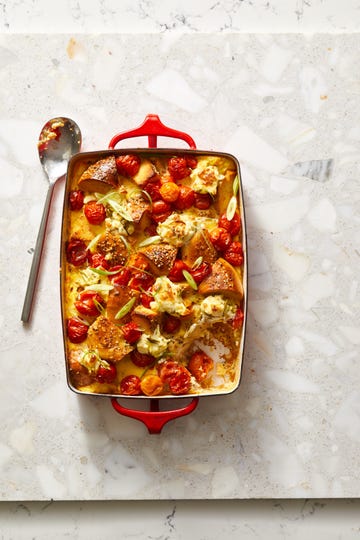 tomato and scallion cream cheese bagel bake on a terrazzo surface