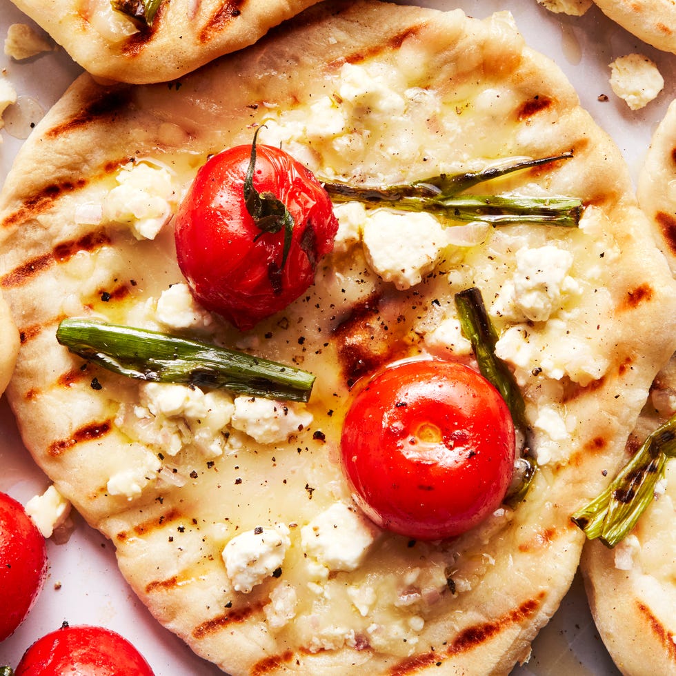 grilled tomato feta pizzettes with scallions and mozzaraella