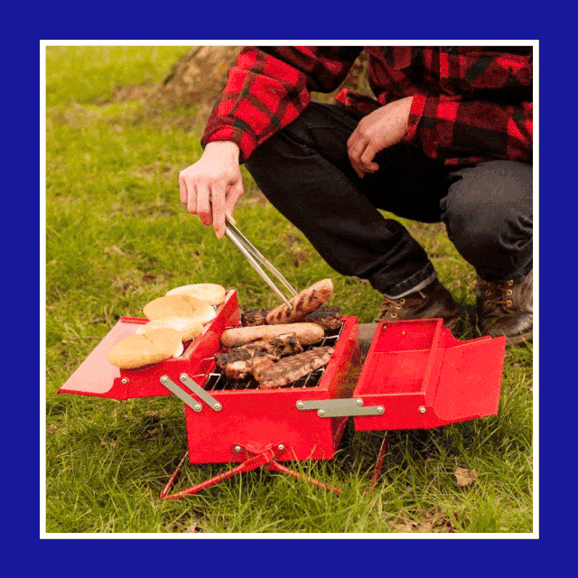person holding and cooking on toolbox grill