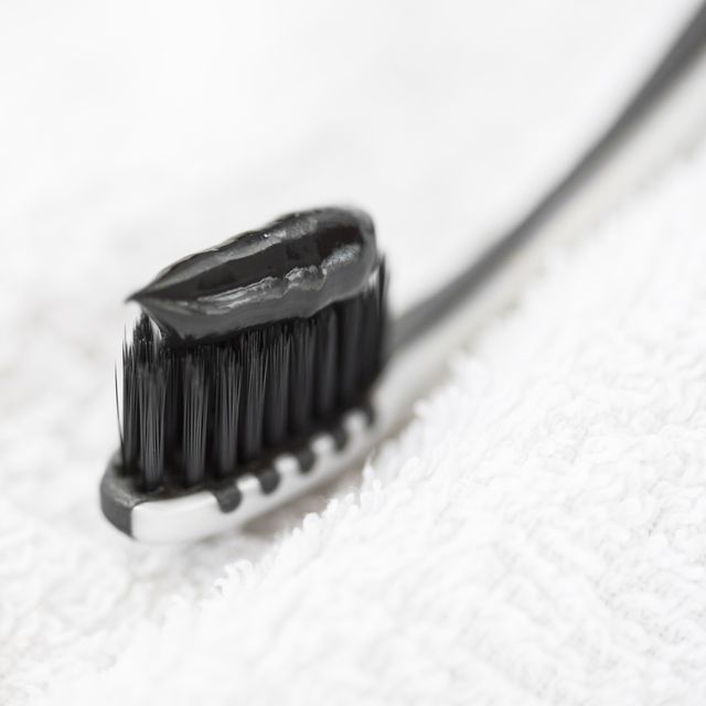 toothbrush with black charcoal toothpaste