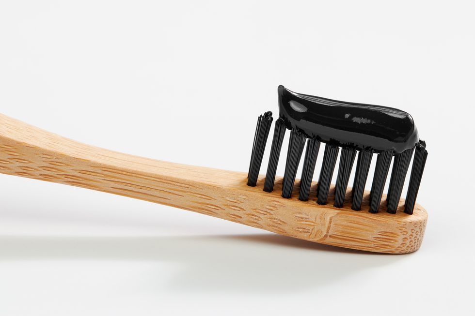 toothbrush with black charcoal toothpaste
