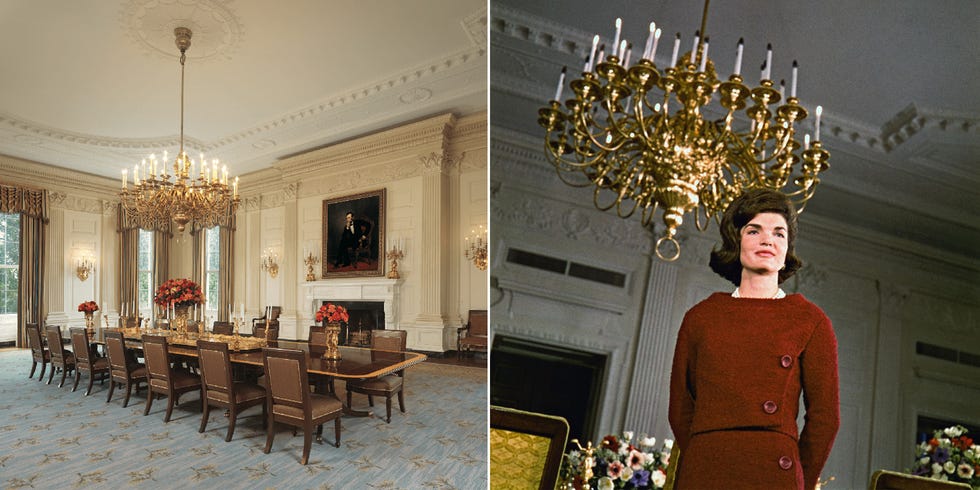 a person standing in a room with a chandelier and chairs