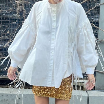 a person wearing a white shirt and shorts