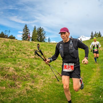 participants in a trail running event traversing a grassy landscape participants in a trail running event traversing a grassy landscape