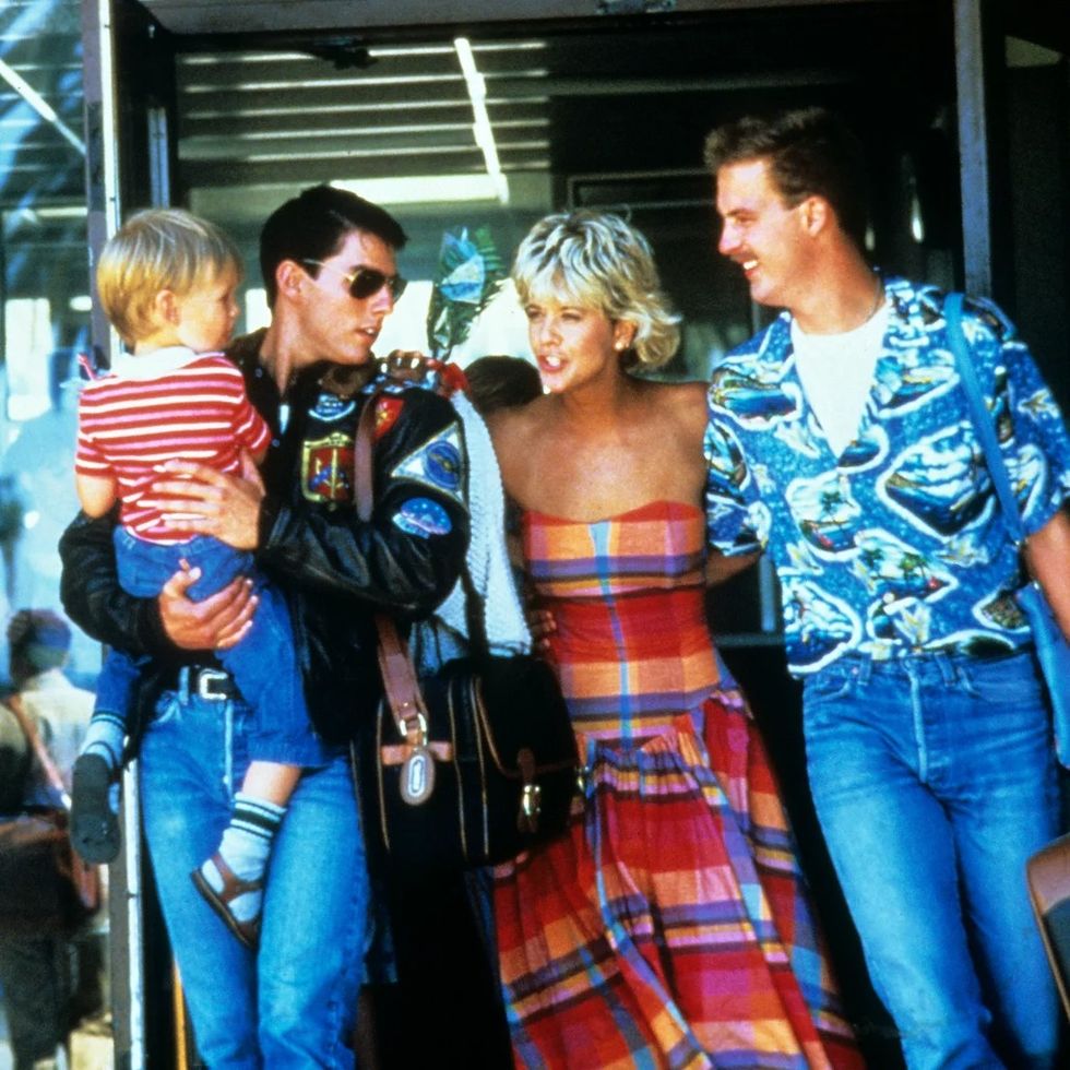 maverick, goose, carole and their son in a scene from top gun