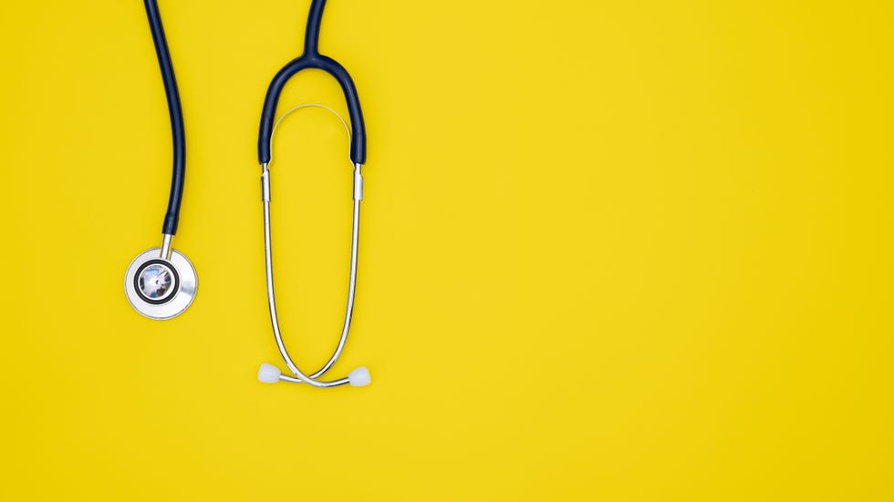 Top view blue stethoscope on yellow background, For check heart or health check up concept