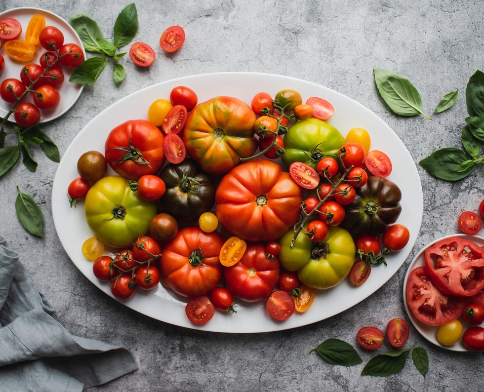 top view of platter of colorful heirloom and cherry tomatoes