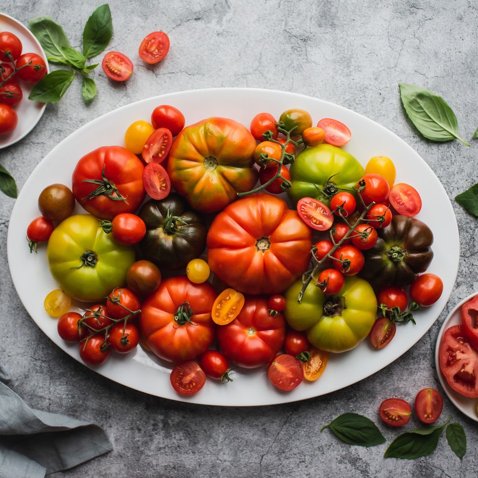 top view of platter of colorful heirloom and cherry tomatoes