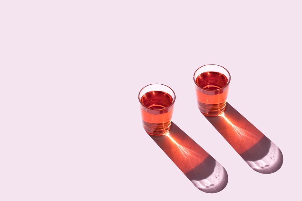 top view of two glasses on the pink background