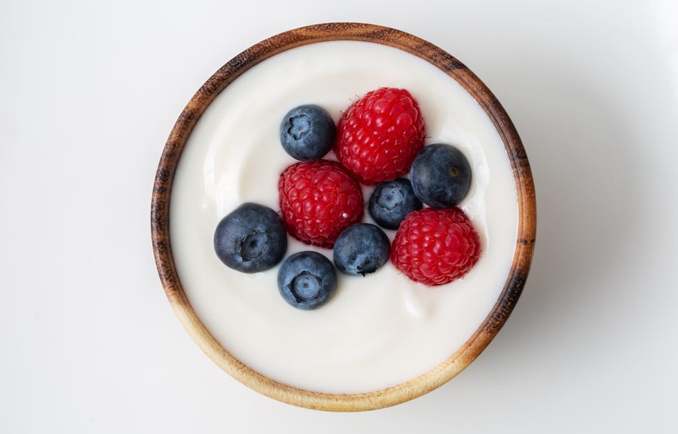 top view of yogurt with raspberry and blueberry