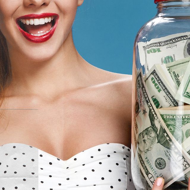 woman smiling and wearing red lipstick while holding a jar of money