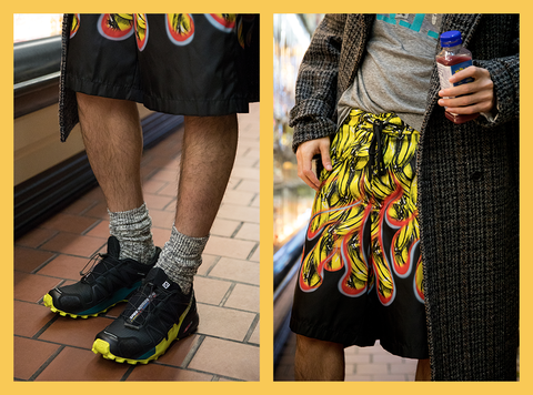 Footwear, Clothing, Black, Yellow, Street fashion, Human leg, Shoe, Leg, Shorts, Fashion, 