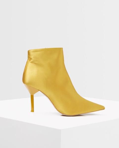 Footwear, Yellow, High heels, Shoe, Leather, Boot, Beige, Leg, 