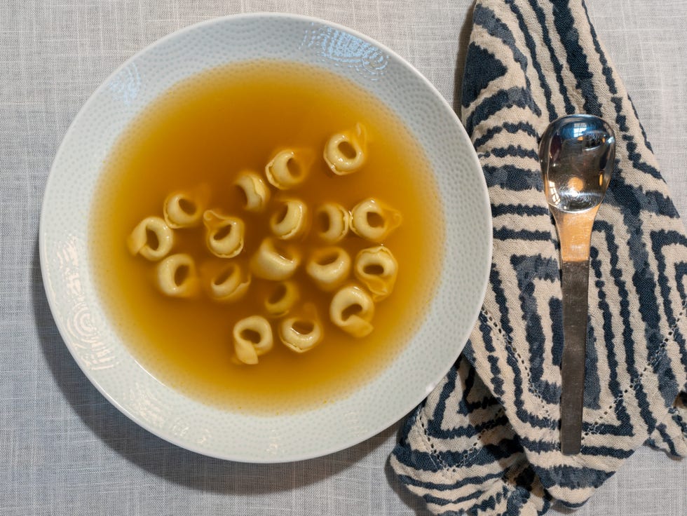 tortellini soup with a place setting, easy pasta recipes