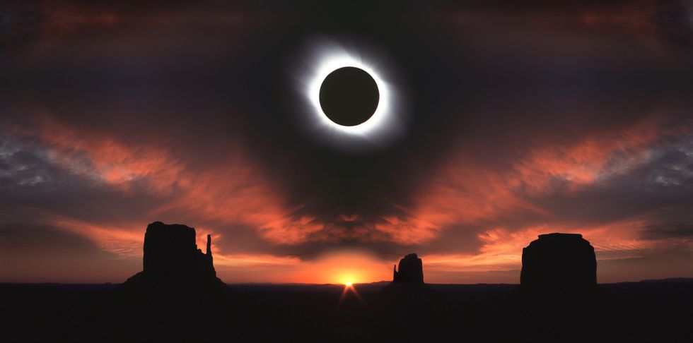 total solar eclipse at monument valley at sunrise