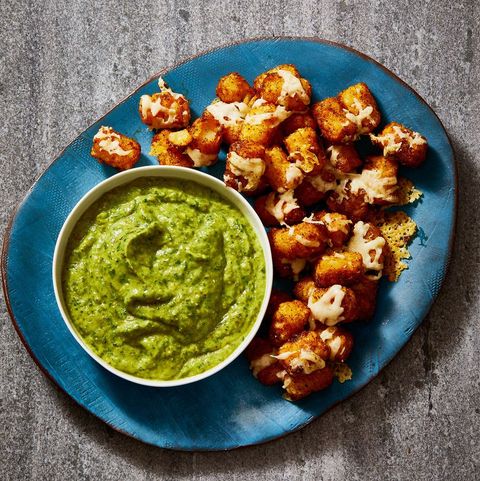 plate of air fryer totchos and green dipping sauce