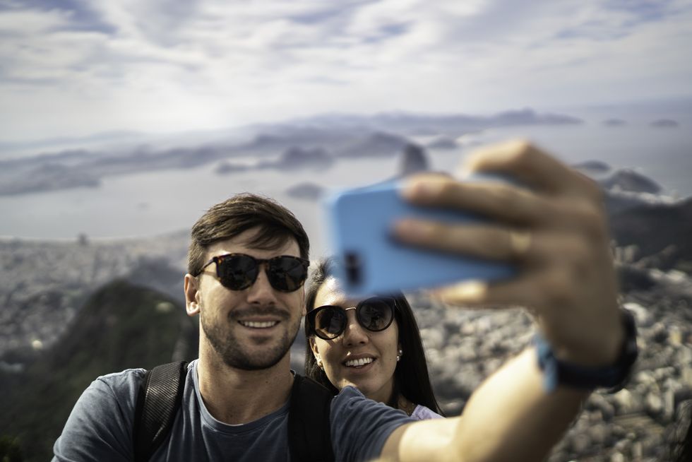 tourist couple taking a selfie in rio de janeiro