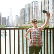 Tourist woman taking selfie in Chicago