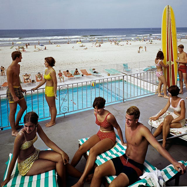 tourists lounging on commander hotel balcony at the beach