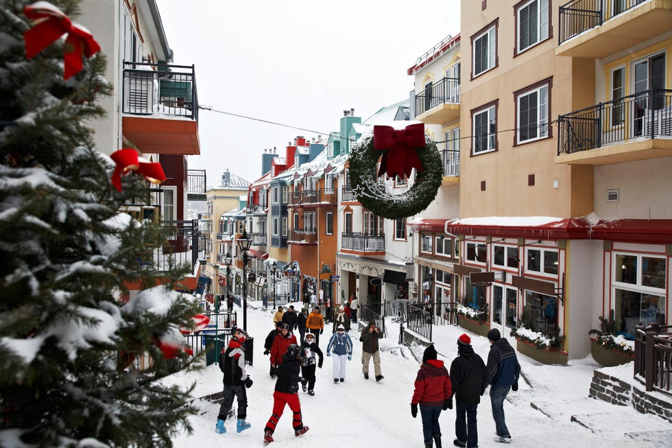 tourists stroll in the village of mt tremblant