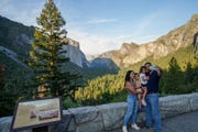 tourists visit the yosemite national park and take photos