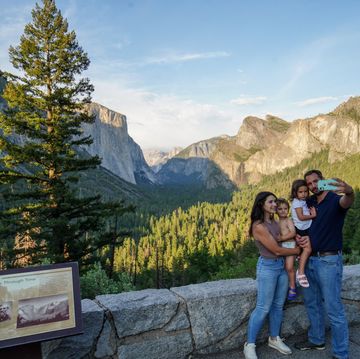tourists visit the yosemite national park and take photos
