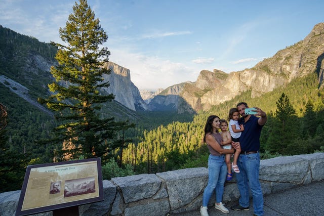 tourists visit the yosemite national park and take photos