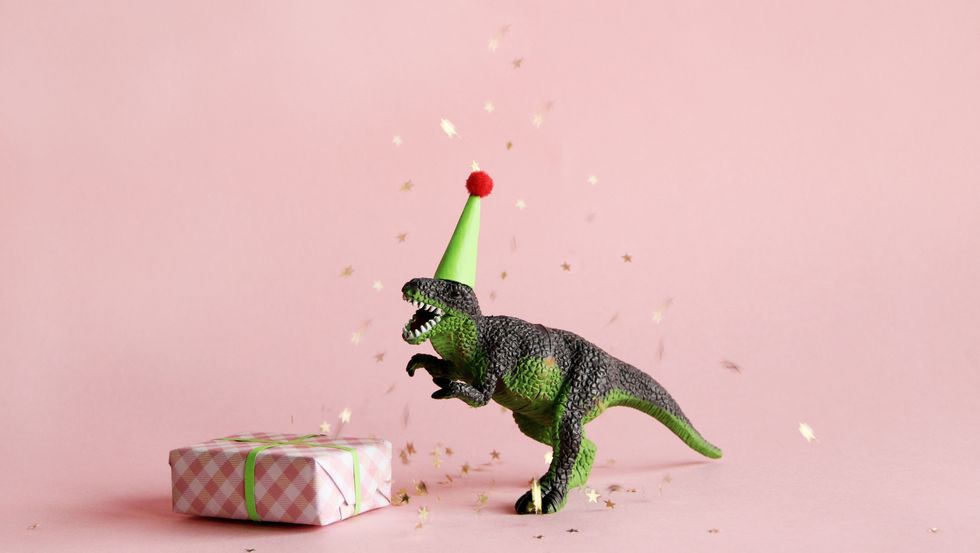 toy dinosaur with birthday gift
