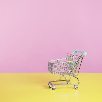 toy shopping trolley with pink  and yellow background