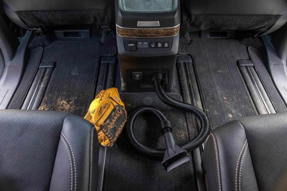 Dashboard of the 2025 Toyota Sienna showing the 12.3-inch touchscreen infotainment system and physical climate controls.