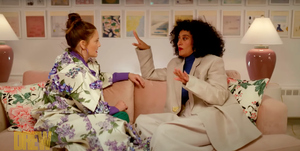 tracee ellis ross and drew barrymore sit on couch talking on the drew barrymore show