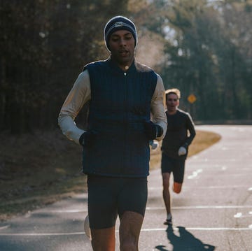 two people running on a road