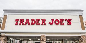 trader joes grocery store entrance with sign