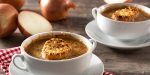 traditional french onion soup on wooden table