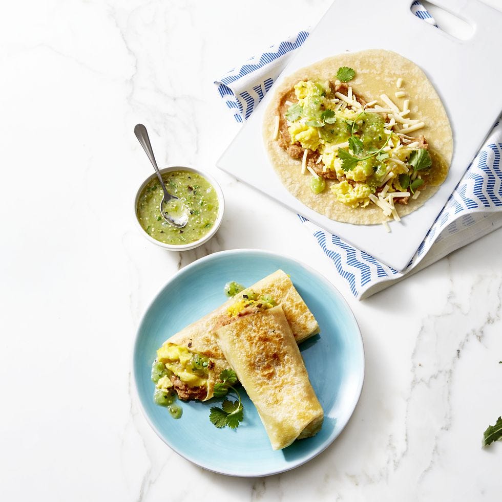 morning burritos with salsa verde on blue plate