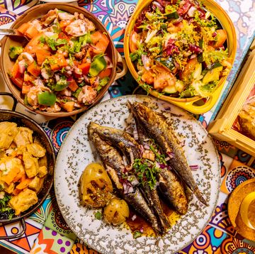 traditional portuguese dinner with griller sardines and octopus salad, overhead view