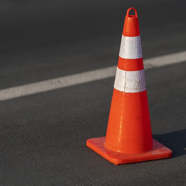 traffic cone,an image of cautions on asphalt road