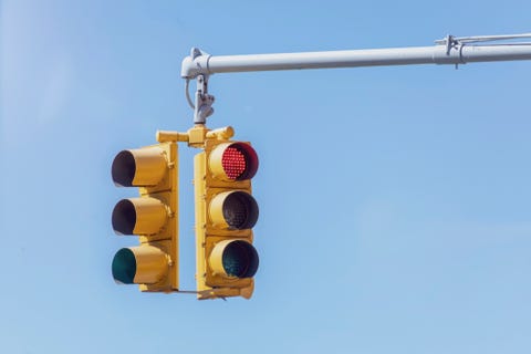 Traffic lights against blue sky.