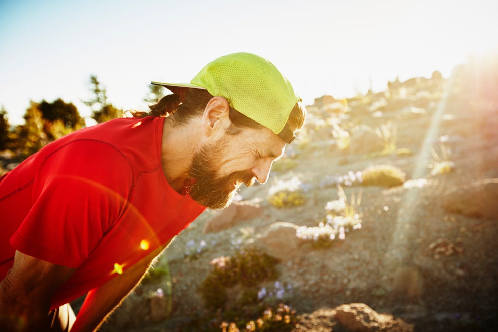 trail runner breathing hard after run on mountain