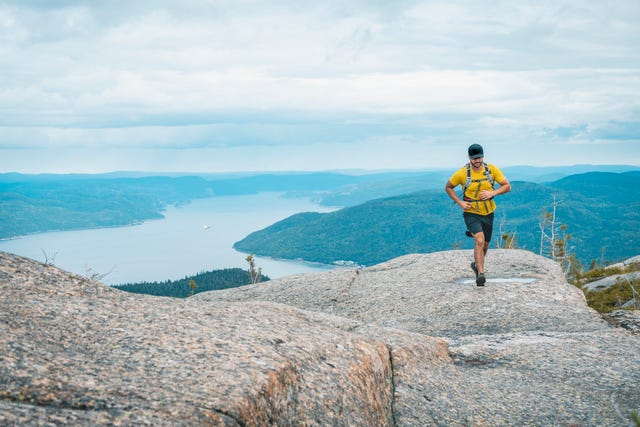 trail runner with saint lawrence in background