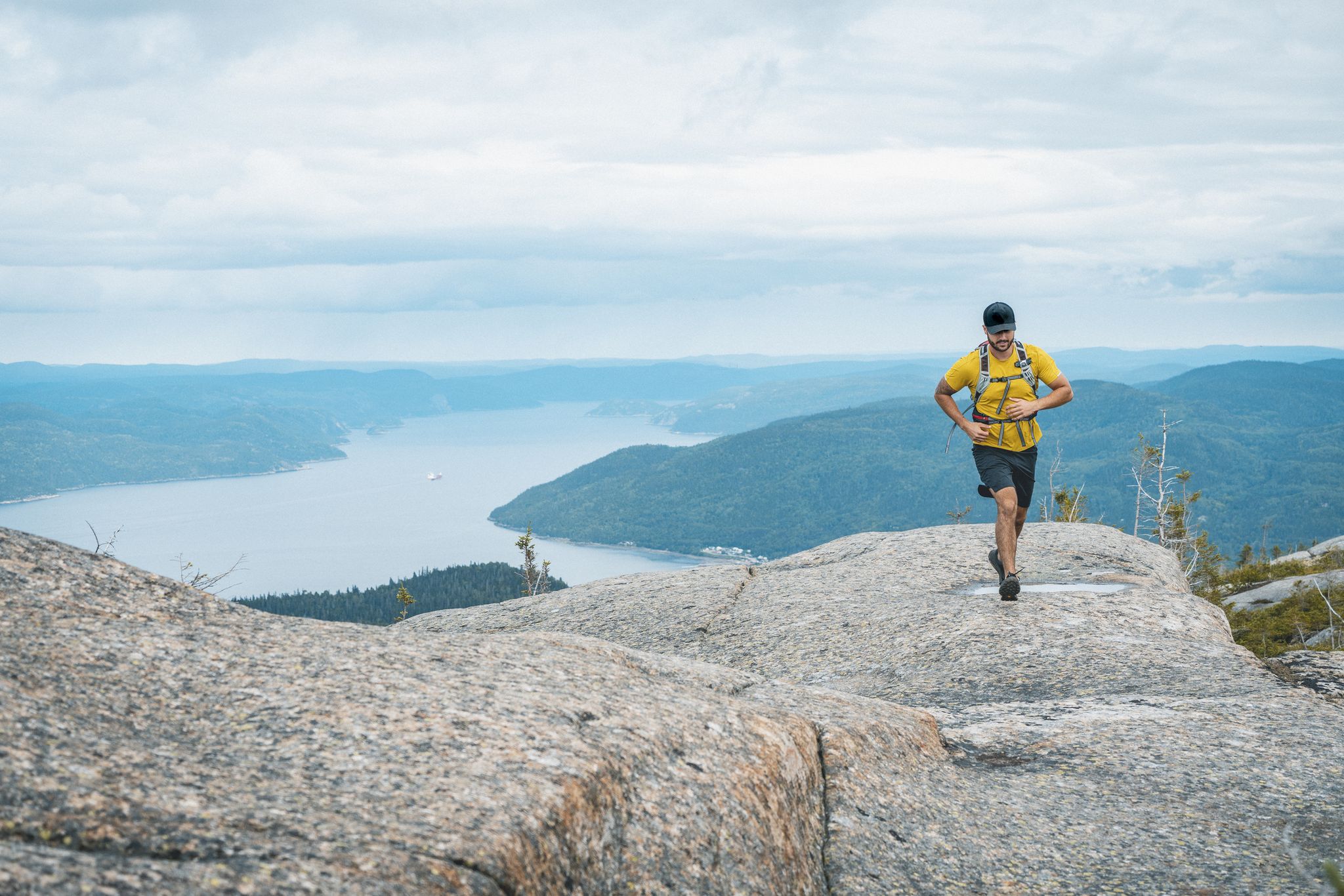 trail runner with saint lawrence in background