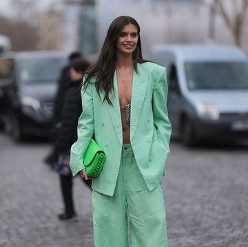 paris, france march 06 sara sampaio wears a pale green oversized blazer jacket, matching pale green wide legs pants, a neon green shiny leather handbag from stella mccartney, white platform soles leather shoes, outside stella mccartney during paris fashion week womenswear fall winter 2023 2024 day eight on march 06, 2023 in paris, france photo by jeremy moellergetty images
