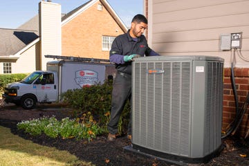 technician with hvac system