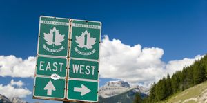 trans canada highway with roadsign through the rocky mountains
